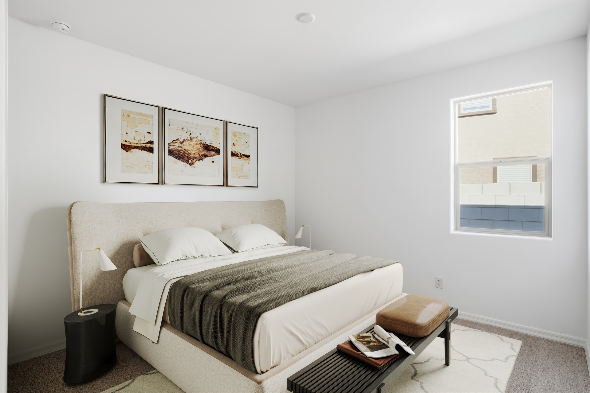 bedroom with a large bed, a black bed bench, and a black nightstand