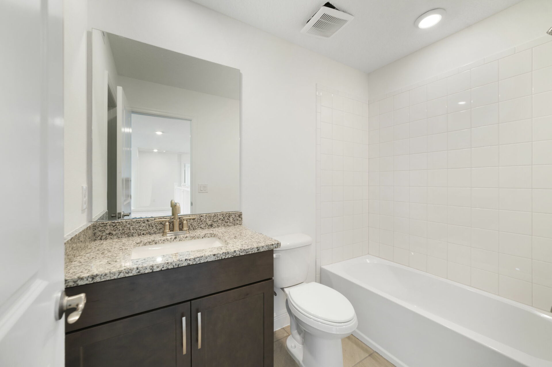 single sink vanity, water closet and shower