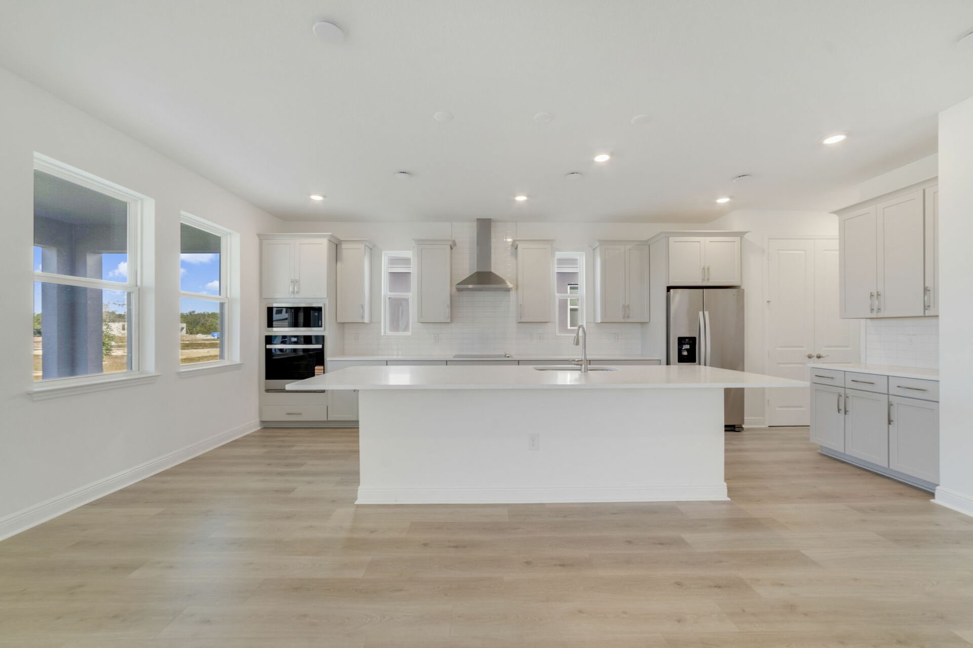 center island kitchen with view of the great room