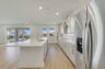 center island kitchen with view of the great room