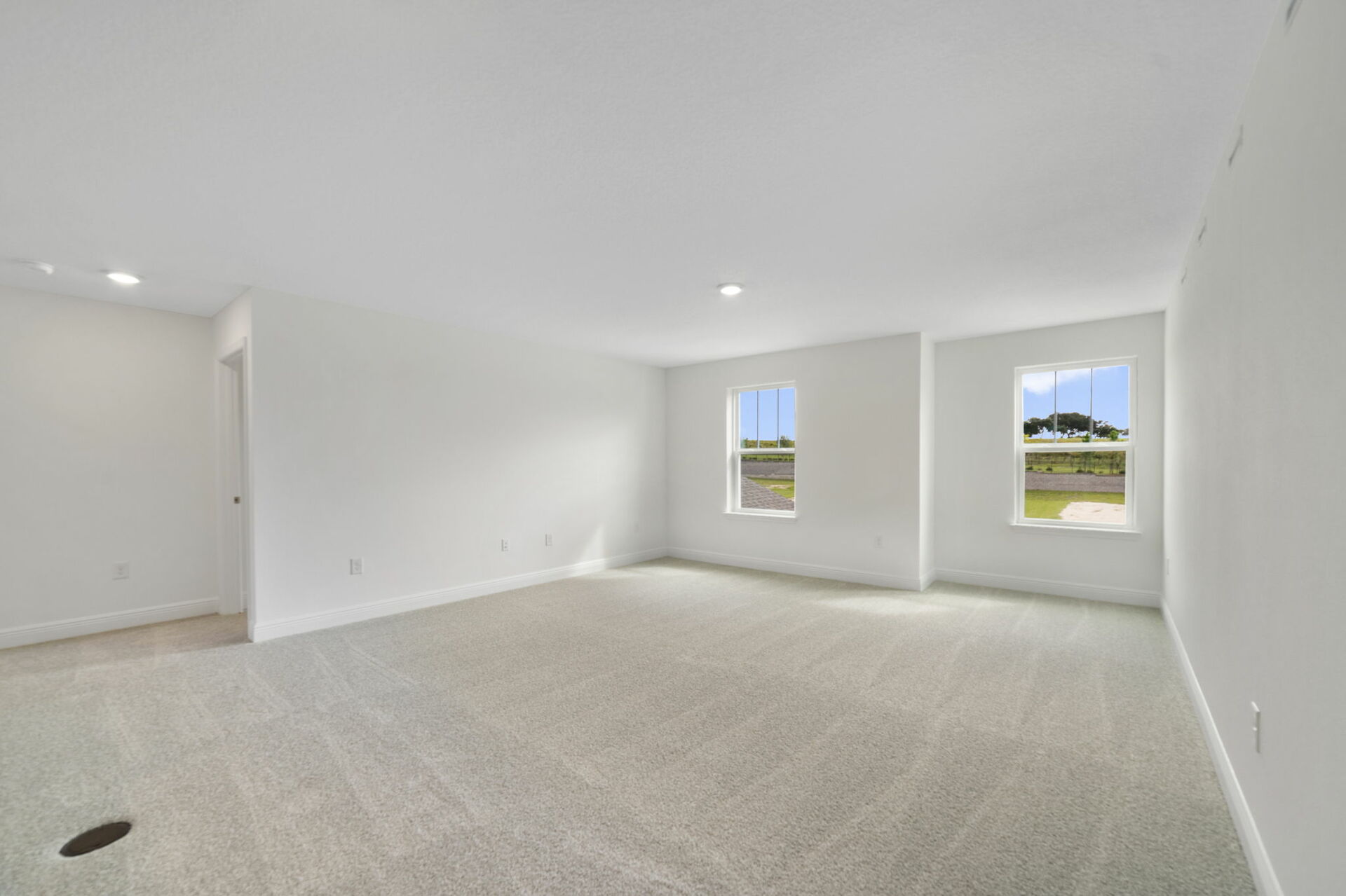 oversized loft with carpet and double windows