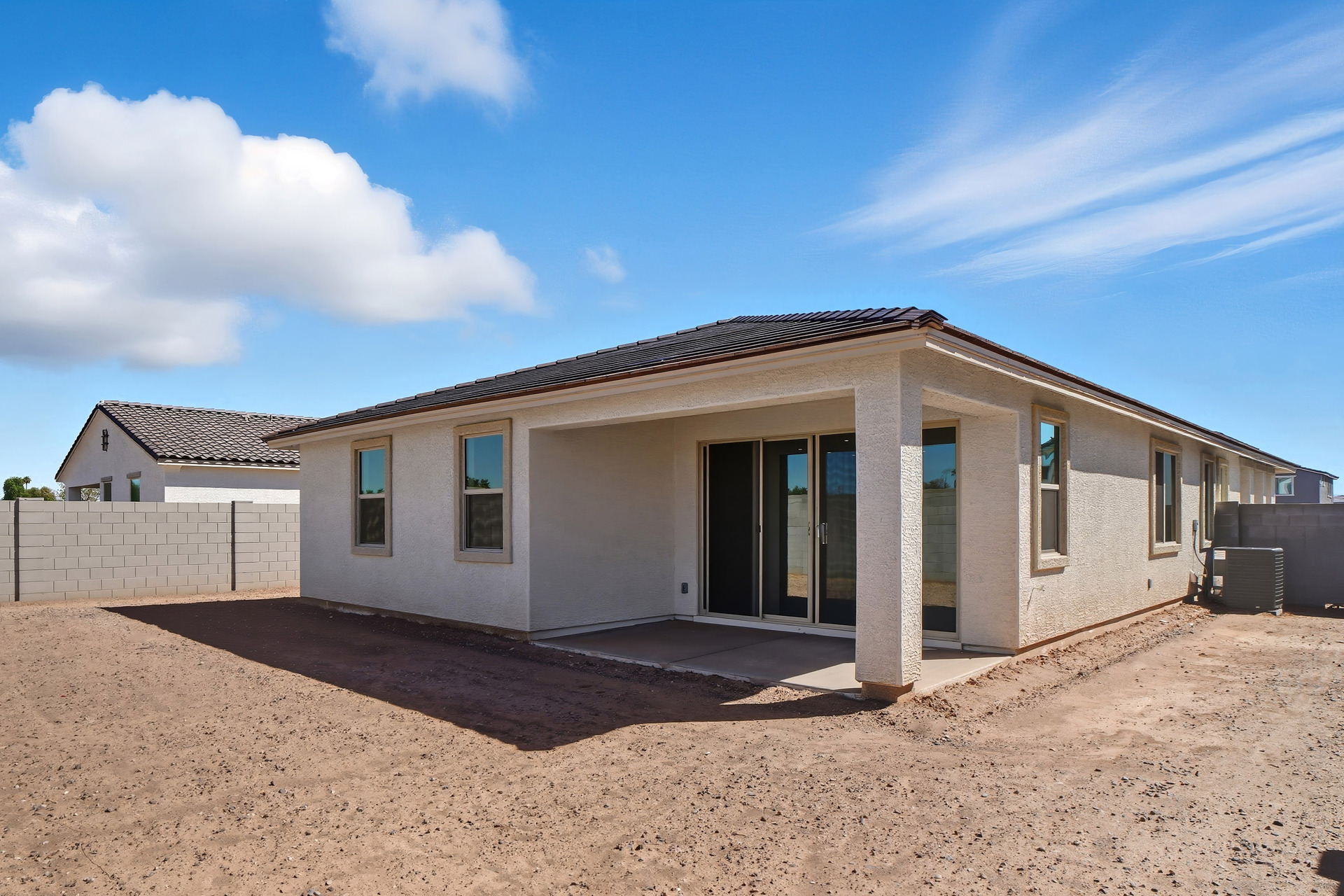 spacious backyard with views of the covered patio