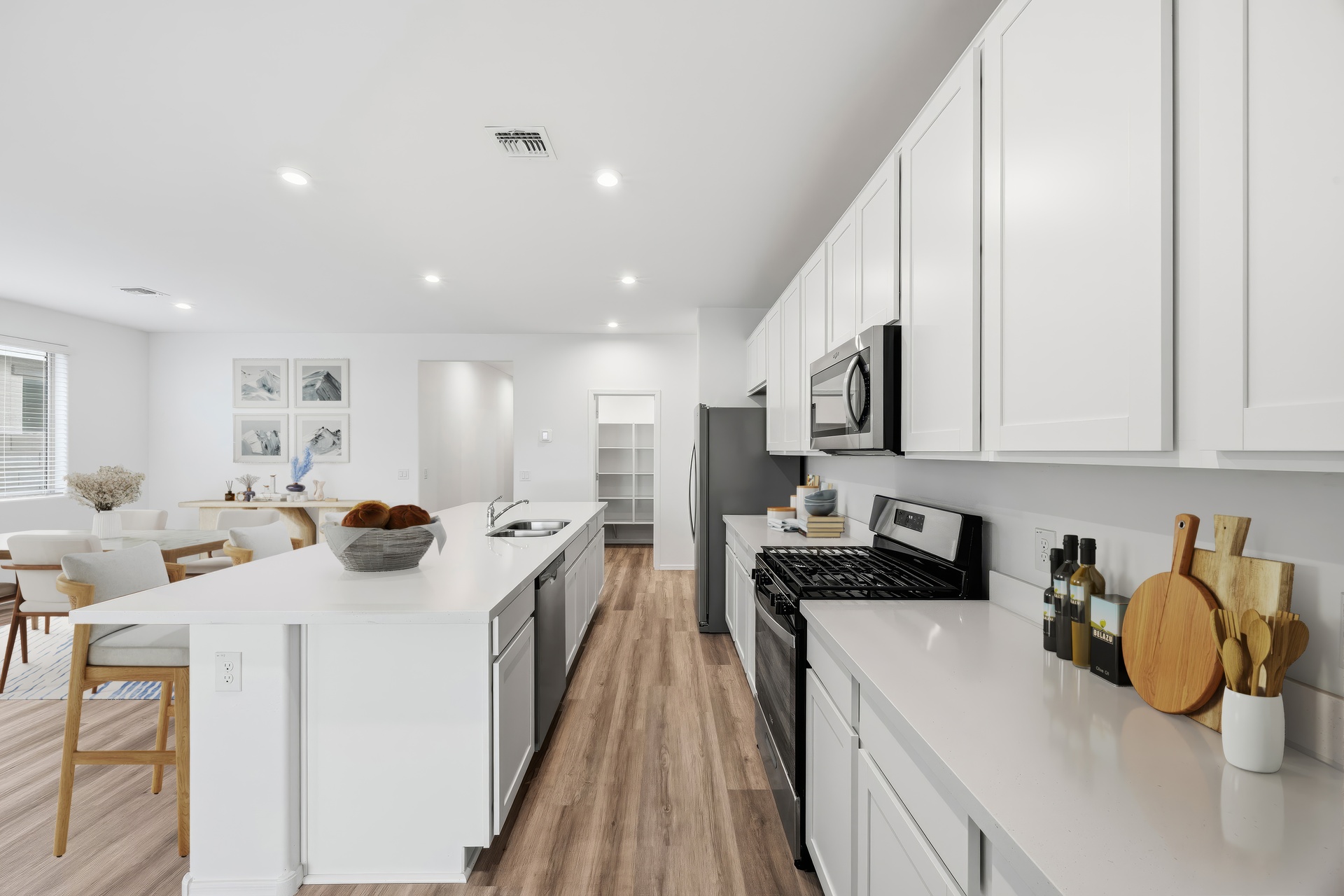 kitchen with wooden barstools and stainless-steel appliances