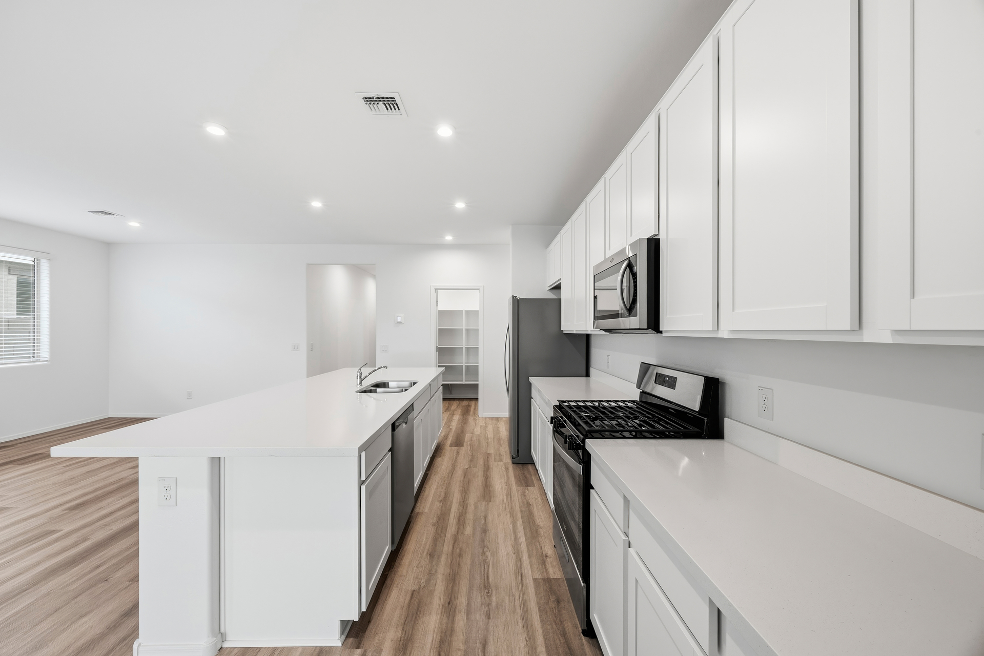 kitchen with stainless-steel appliances, and white countertops