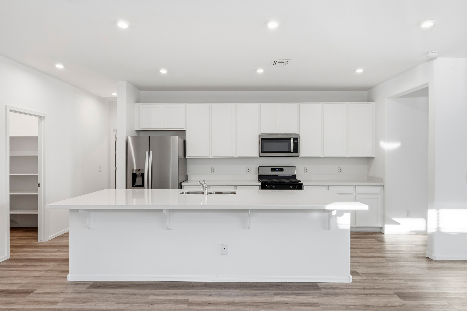 kitchen with stainless-steel appliances, and white countertops