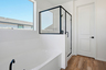 bathroom with walk-in shower and soaking tub