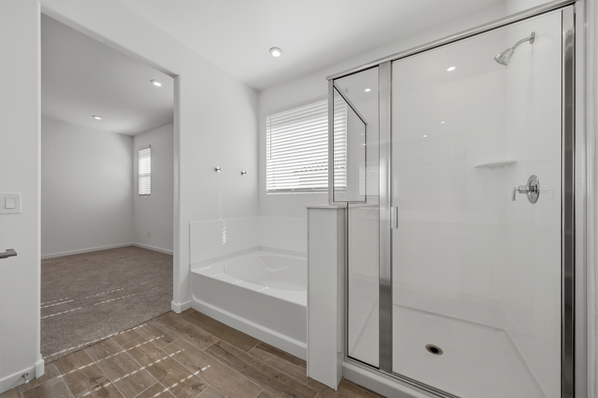 spacious bathroom with a walk-in shower and soaking tub