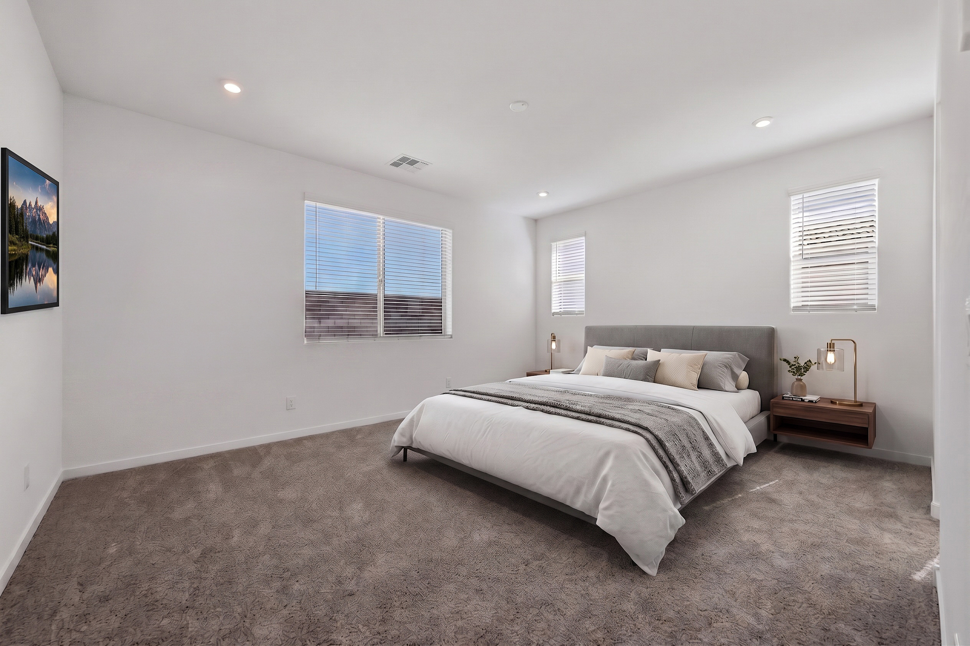 spacious bedroom with a king-sized bed, walnut wooden nightstands, and a mounted tv