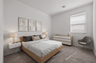 spacious bedroom with oak floating bedframe, white floating nightstands, and oak dresser