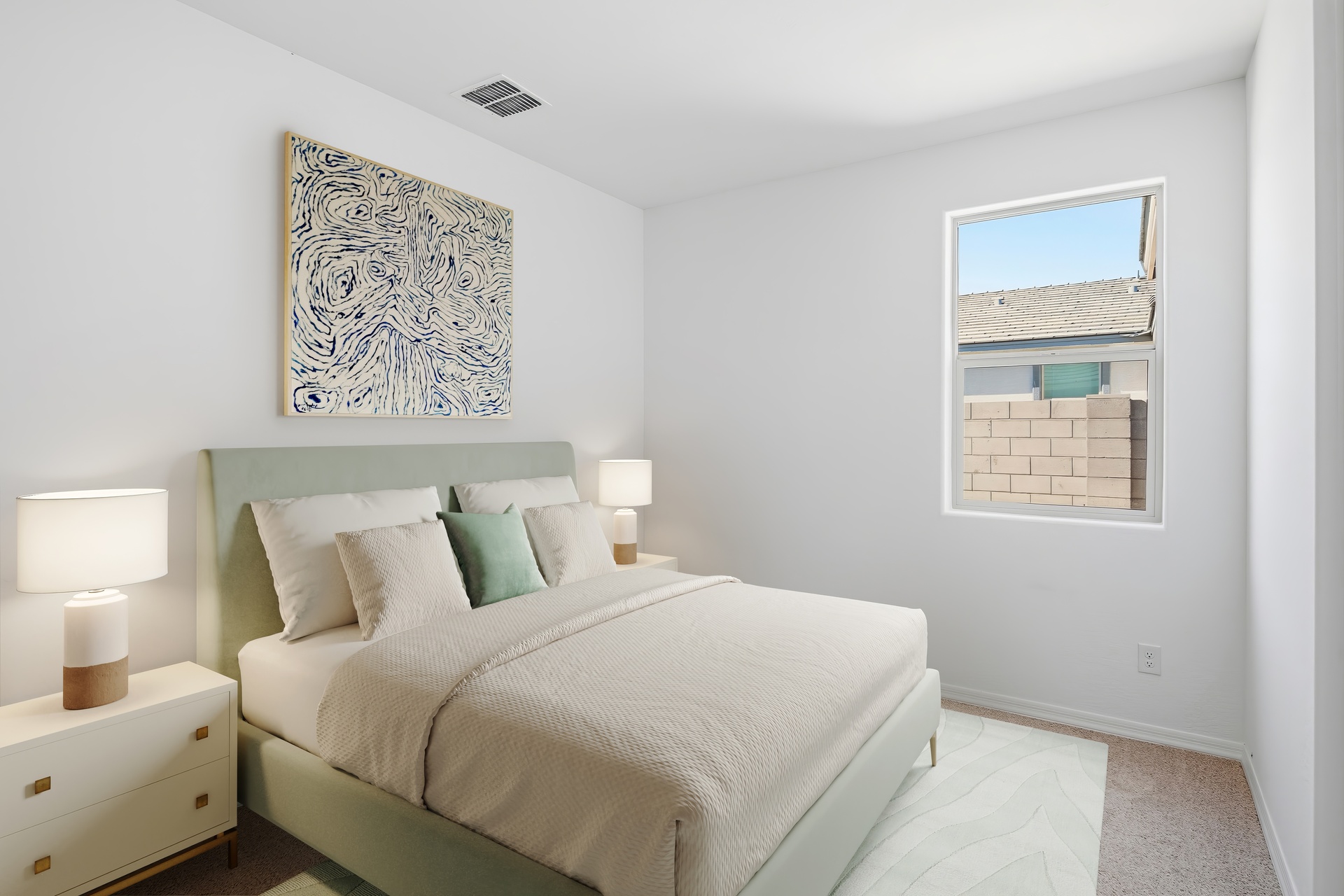 bedroom with light green bed frame and white nightstands