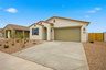 single-story single-family home with desert landscaping and concrete driveway