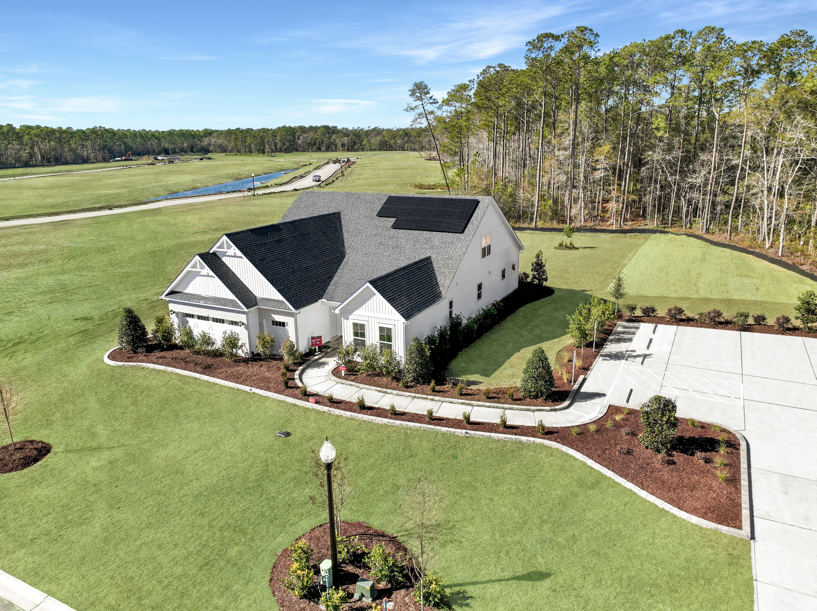 home with white vinyl siding and green grass