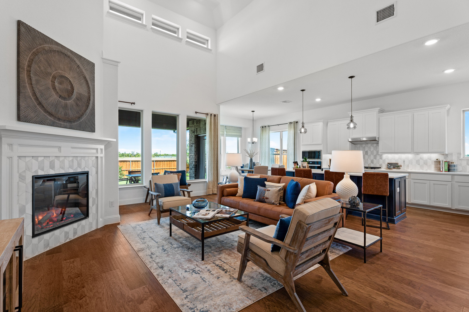 family room with high ceilings and large windows