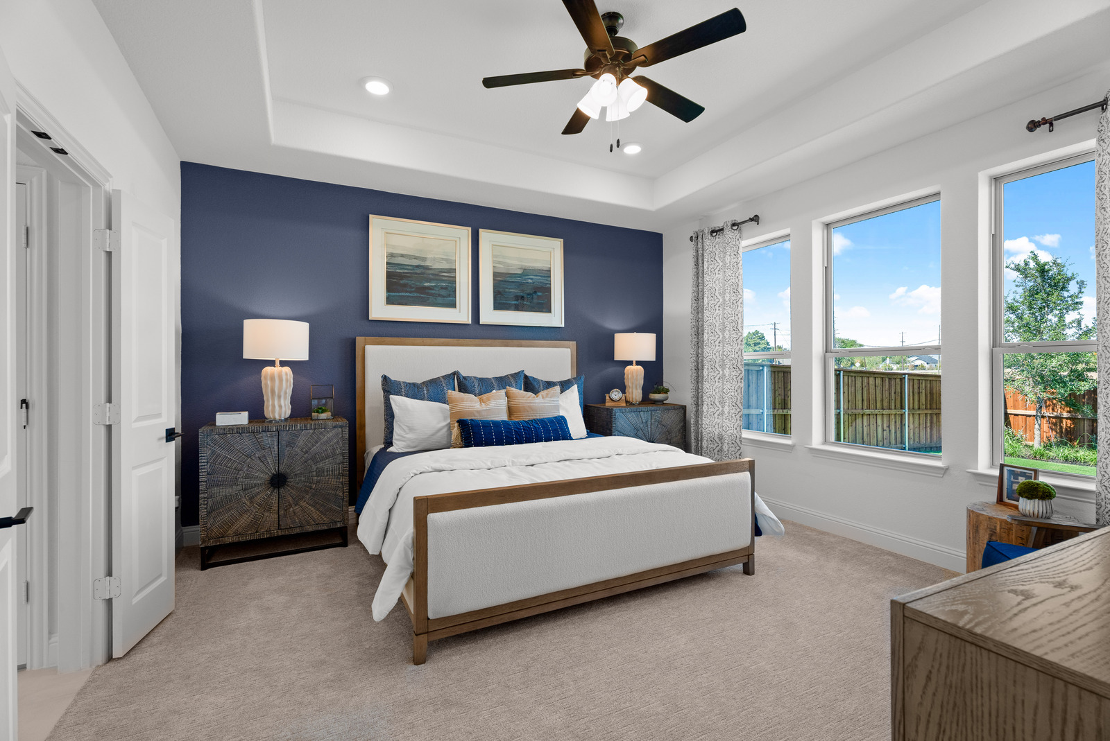 primary bedroom with blue accent wall