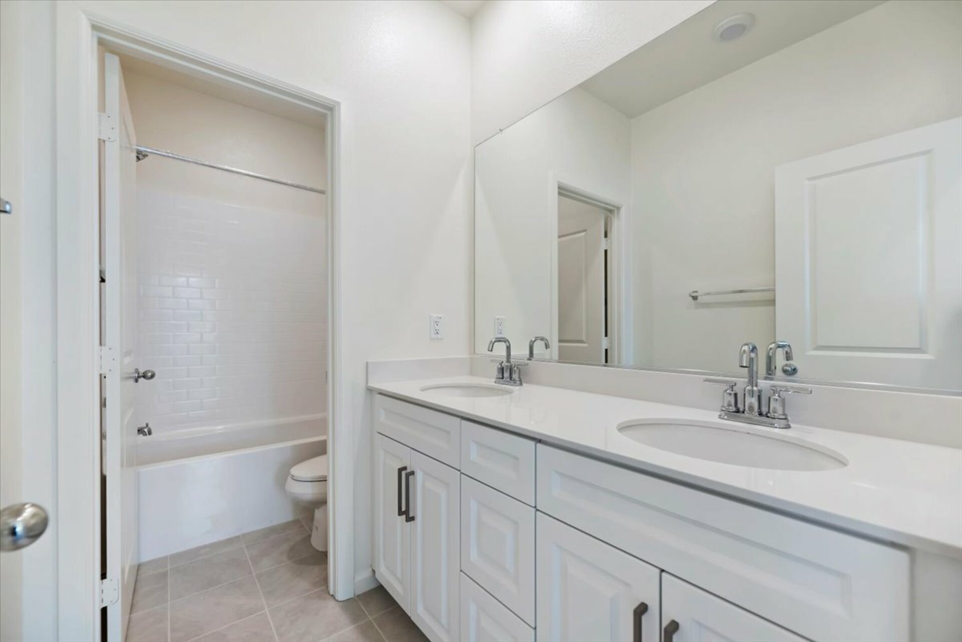bathroom with neutral floors and white countertops