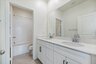bathroom with neutral floors and white countertops