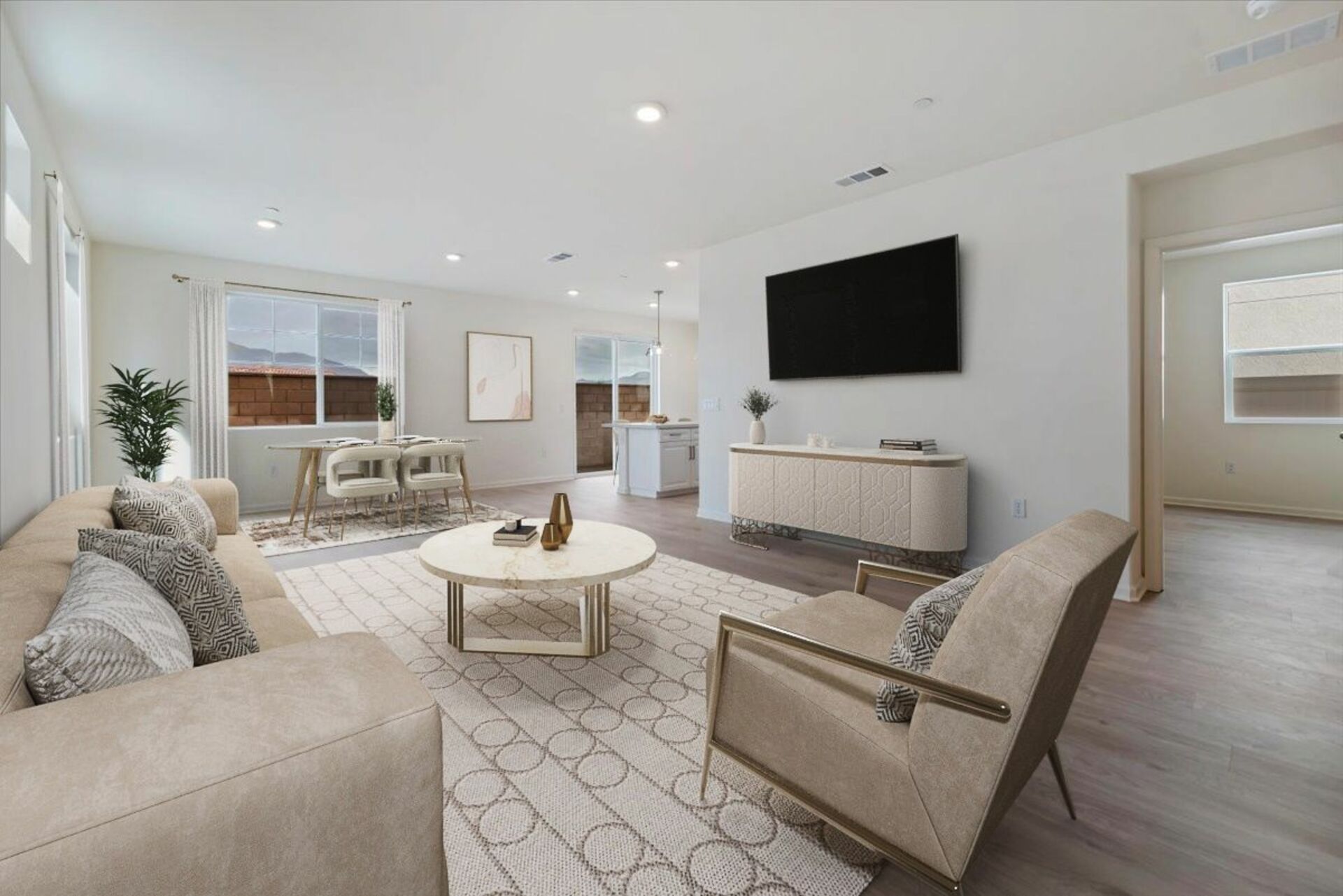 great room with neutral floors near dining area and kitchen