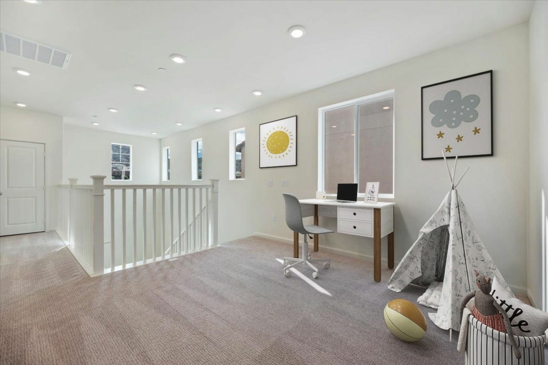 loft with neutral carpet and large windows