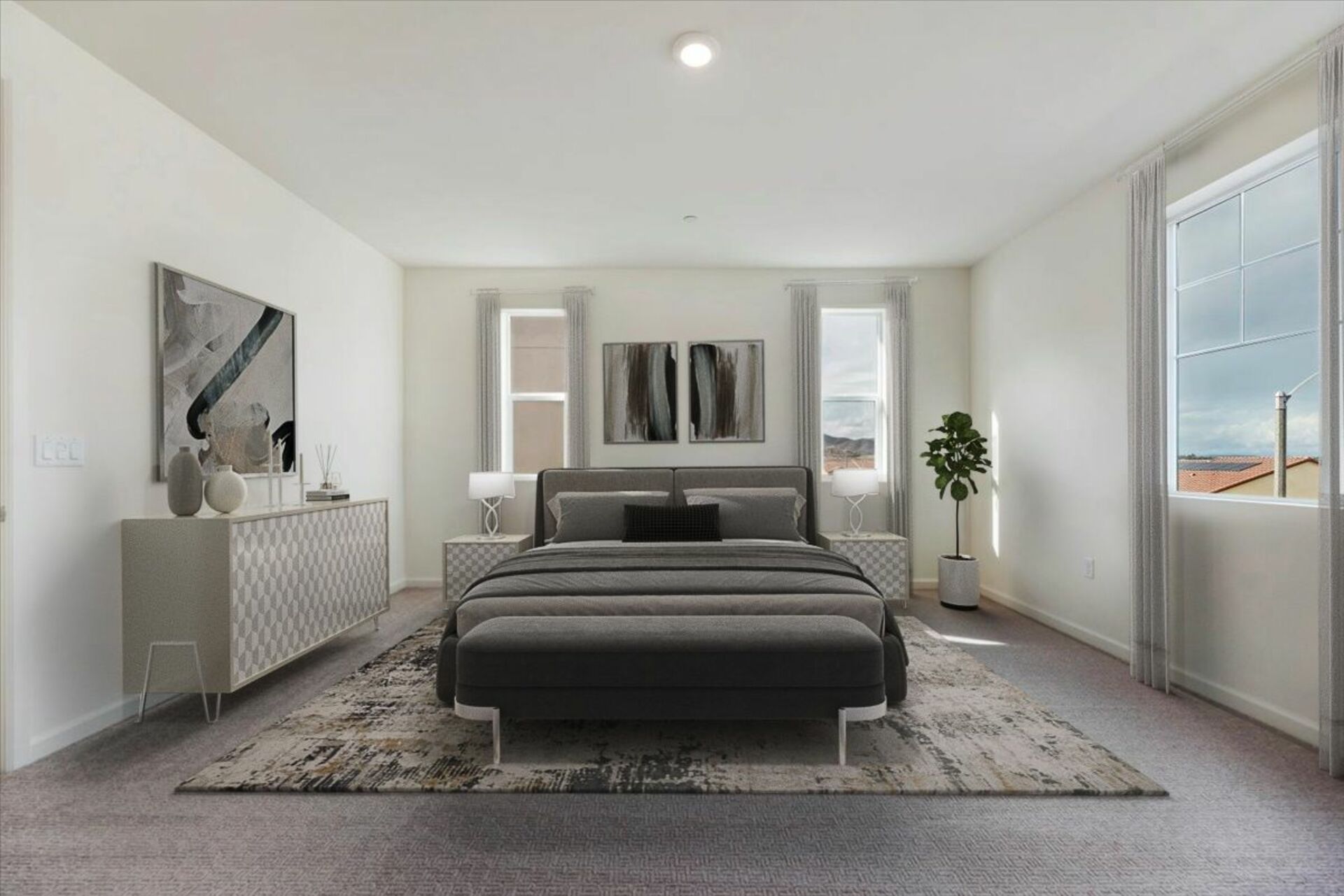 primary bedroom with neutral floors and large windows