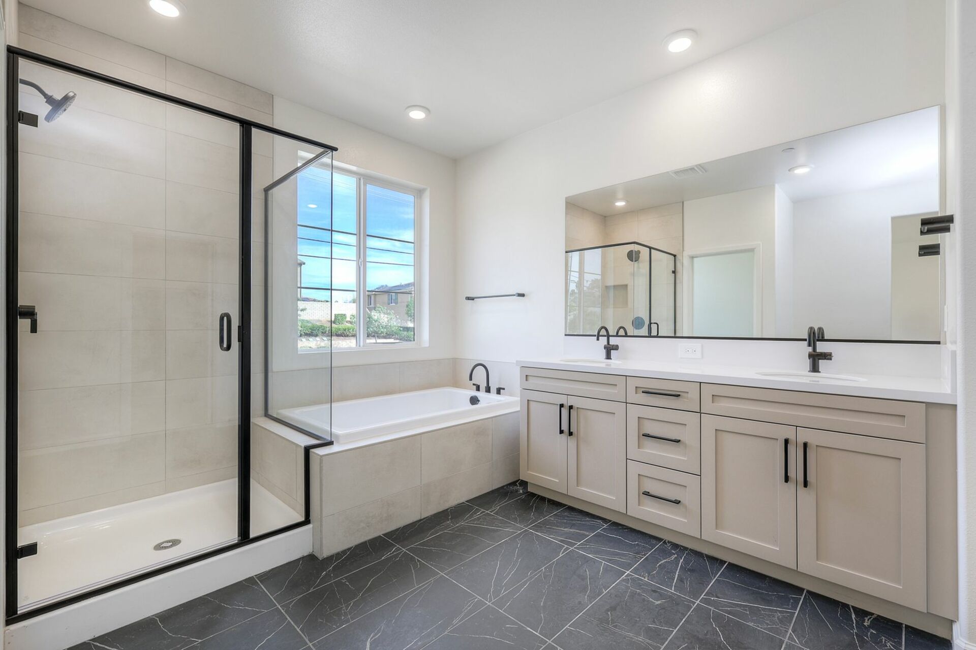 primary bathroom with a walk-in shower and a separate soaking tub