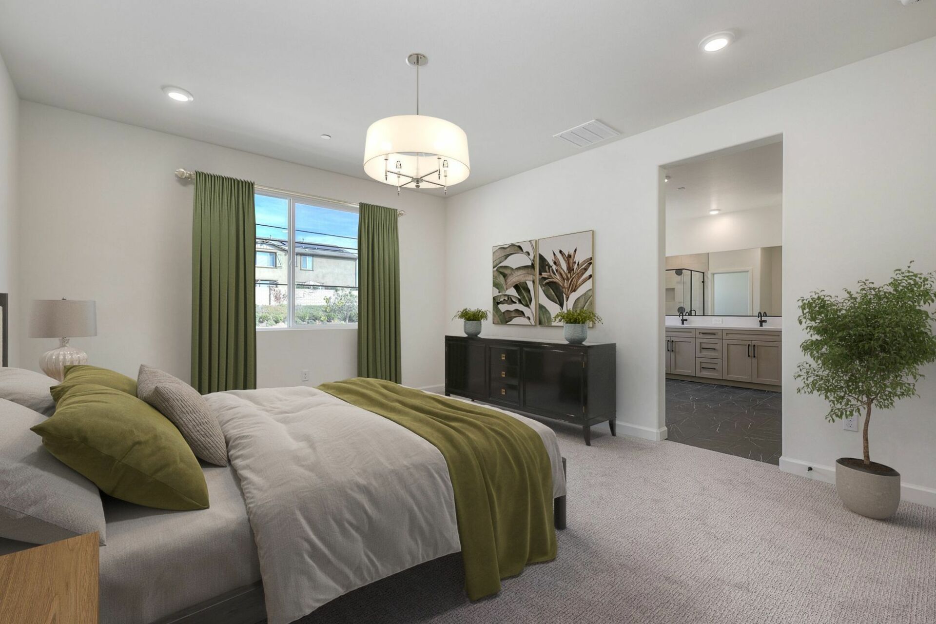 large room featuring a bed, lighting fixture, and a dark black dresser