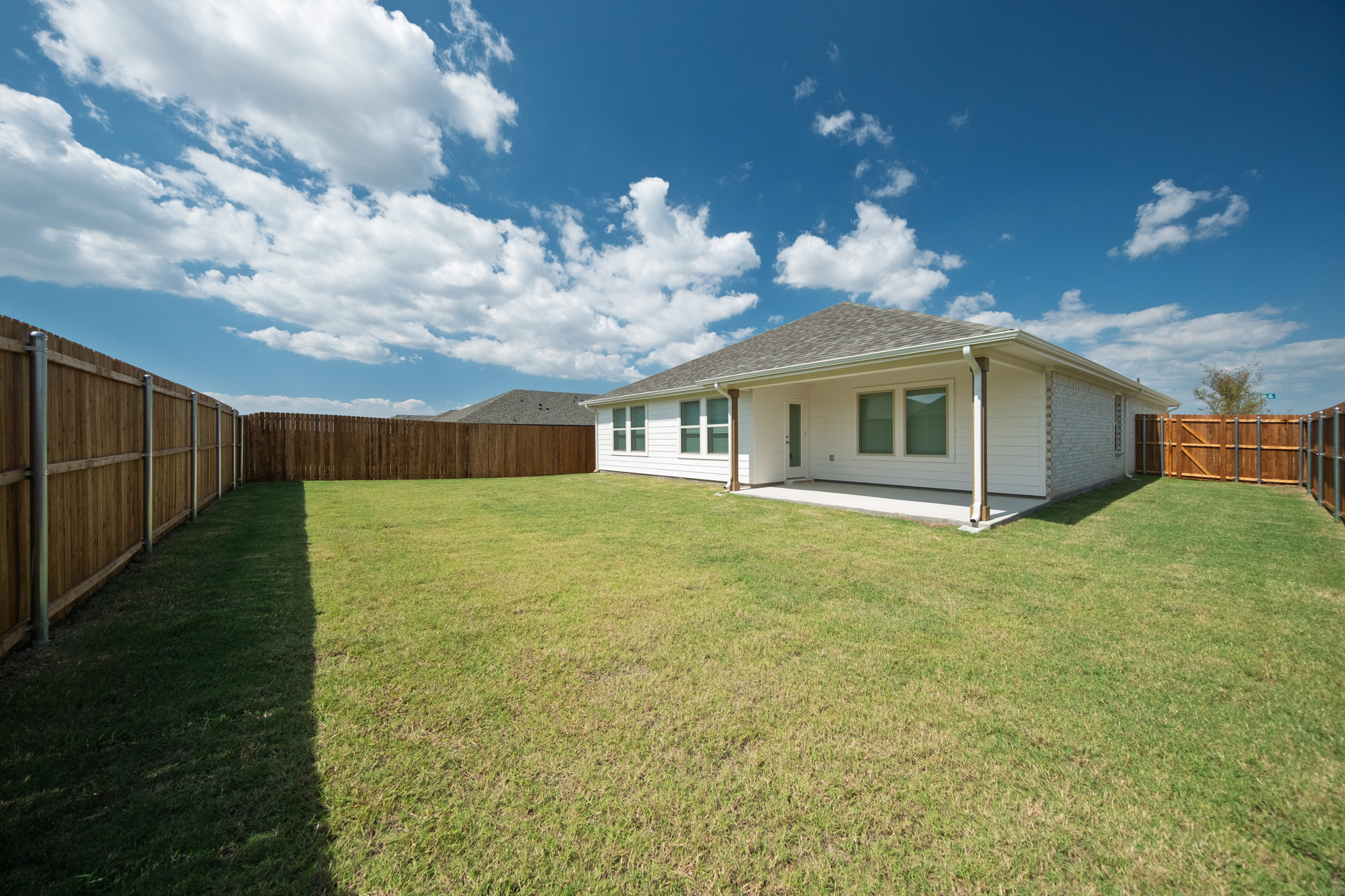 backyard of home with covered patio