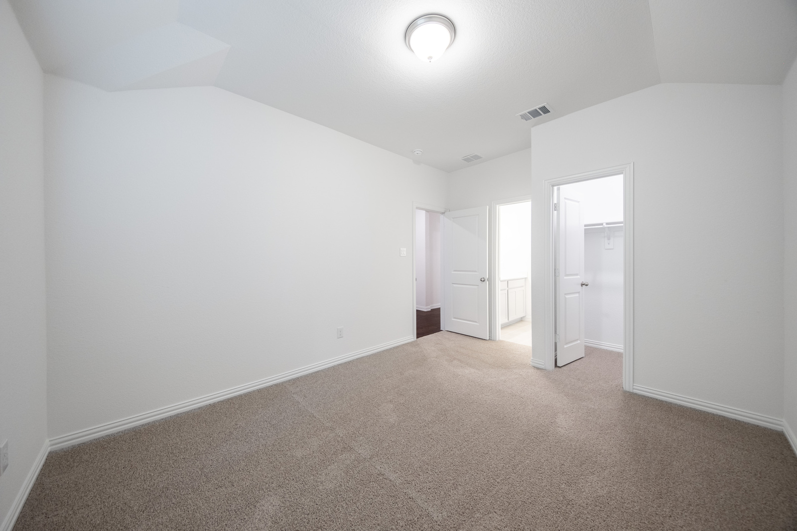 guest bedroom with walk-in closet