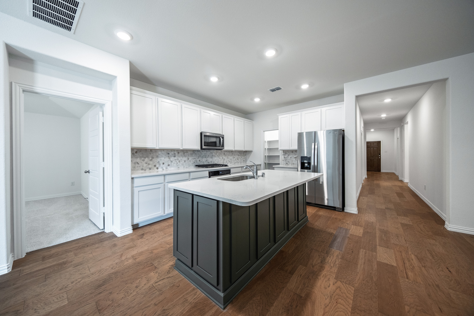 open kitchen with white and gray cabinets