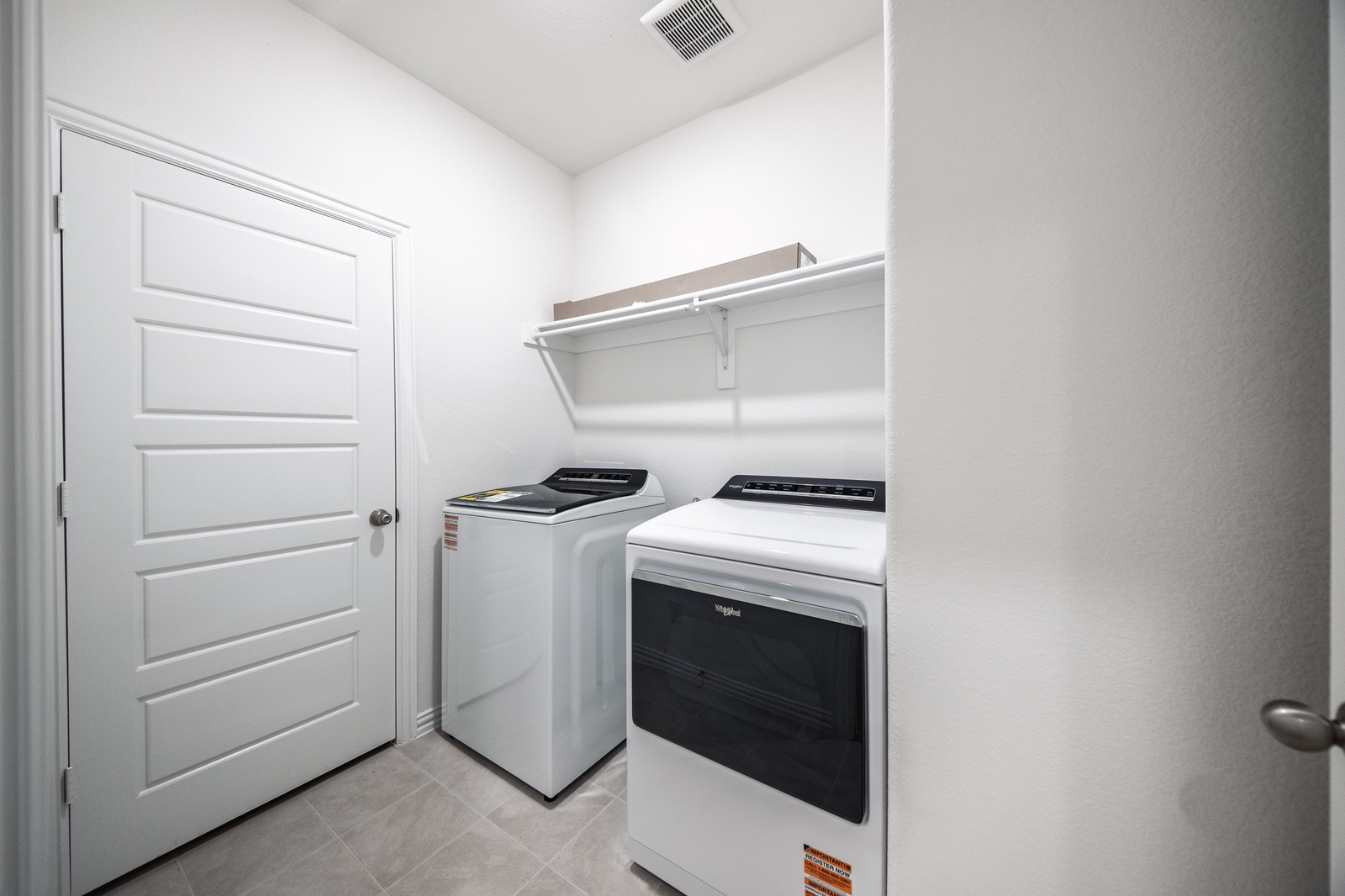 laundry room with included washer and dryer