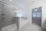 primary bathroom with walk-in shower and soaking tub