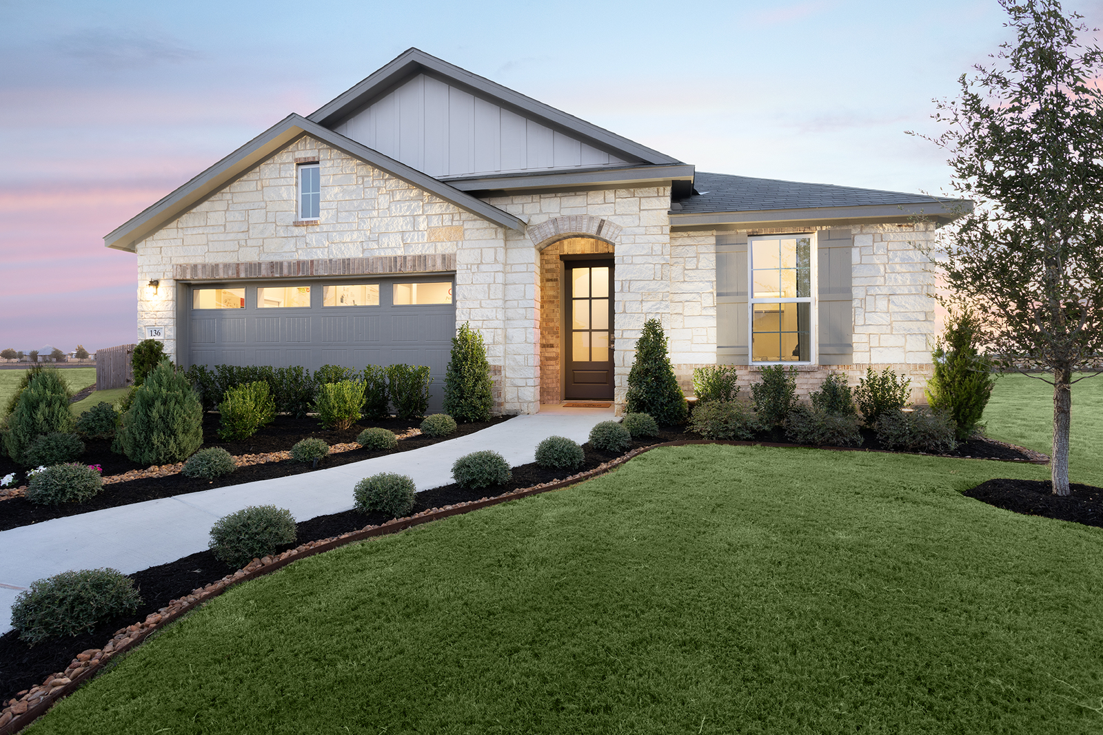 1-story home exterior with brick and stone masonry
