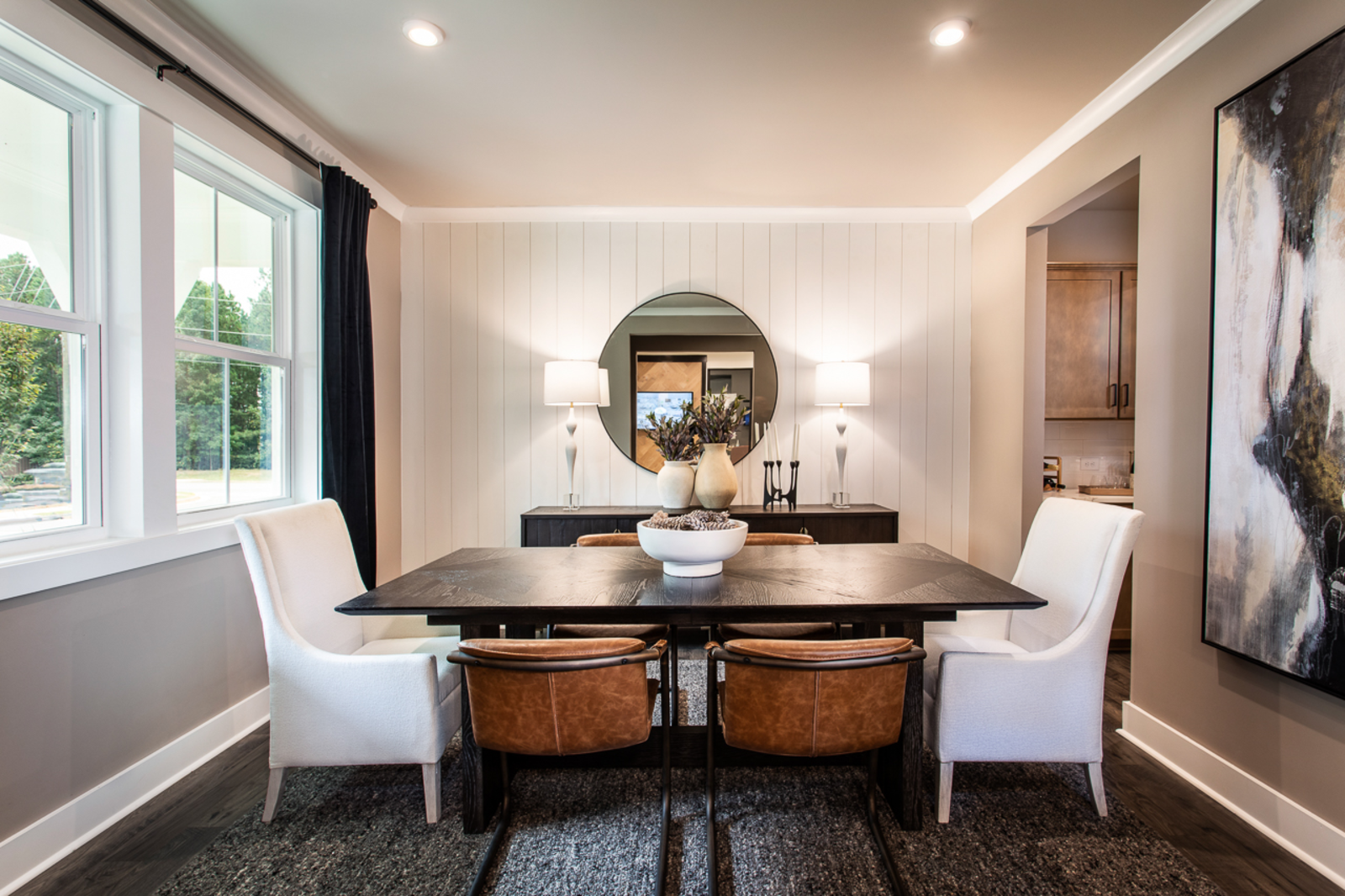 dining room with large windows and plank flooring