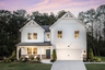 front of home with brick and white siding