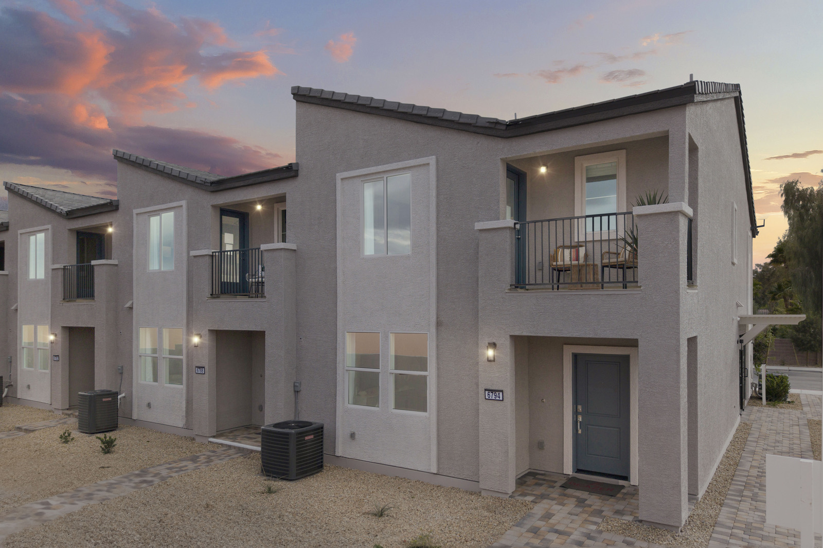 townhomes with balconies and desert landscaping