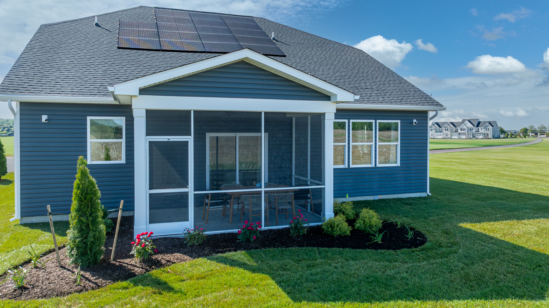 single-family rear exterior with covered patio and solar panels