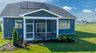 single-family rear exterior with covered patio and solar panels
