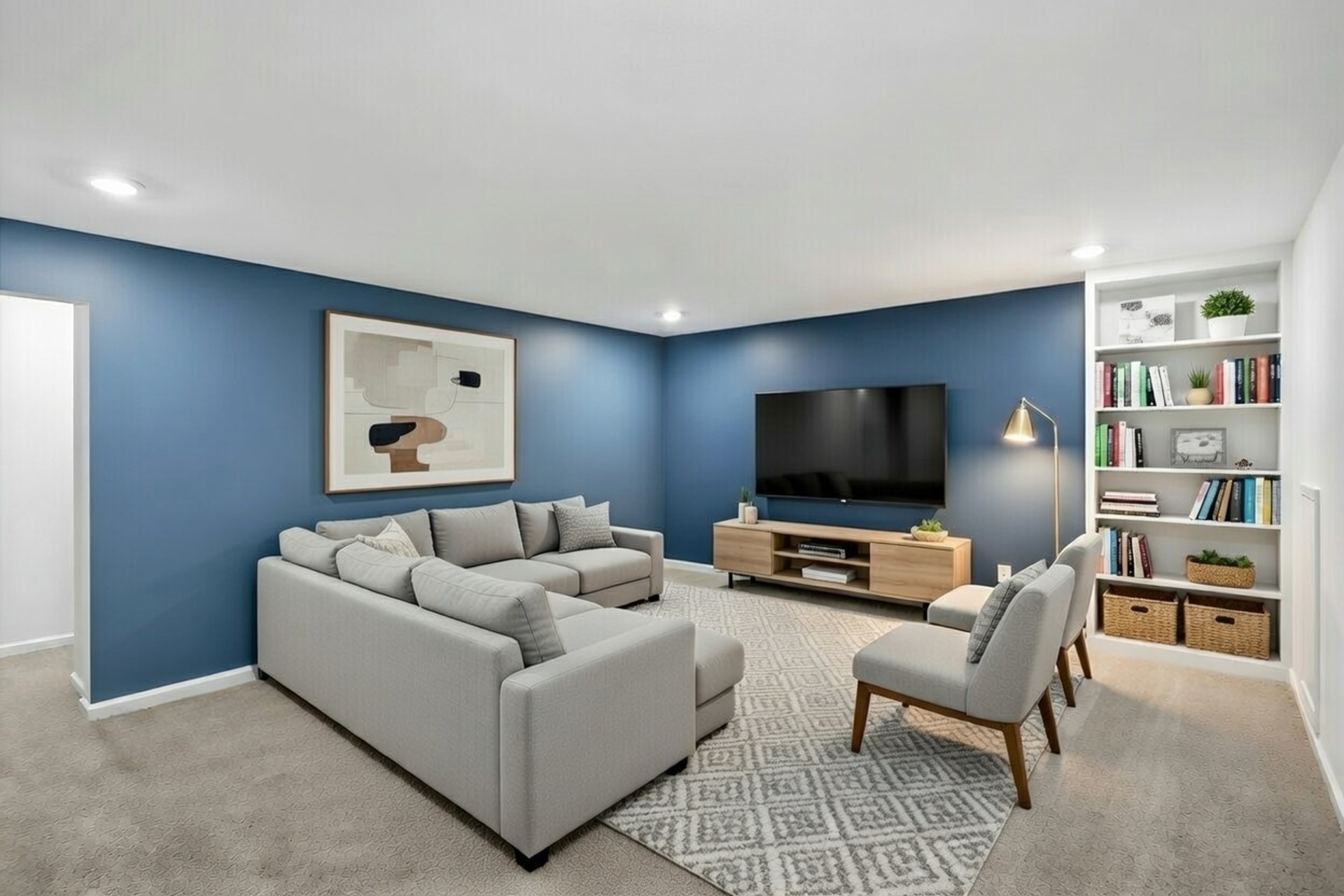 loft with blue walls and a television mounted on the wall