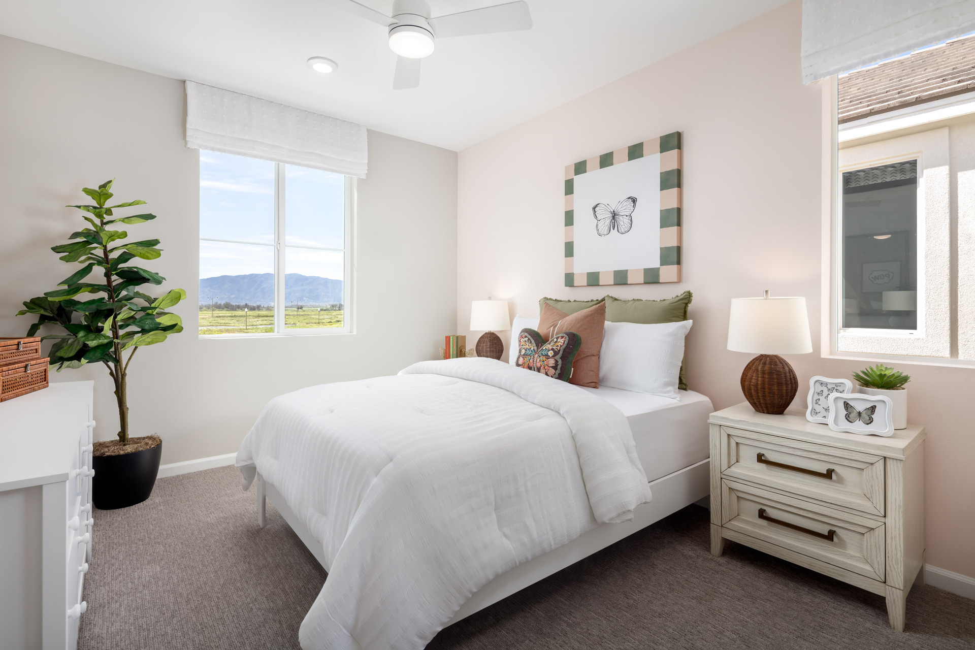 bedroom with neutral carpet and large window