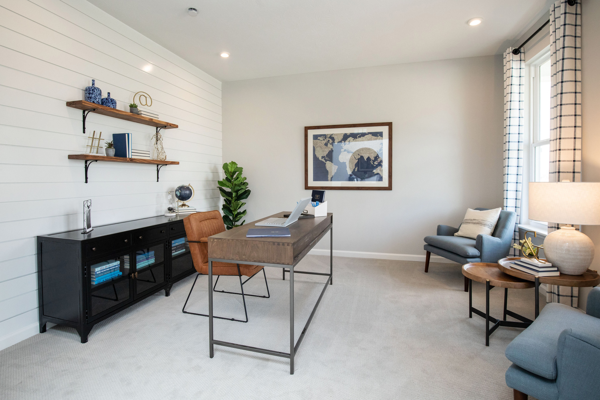 study on main floor with windows and desk 