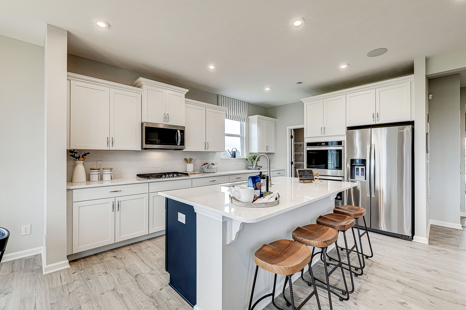 open kitchen with spacious island and bar seating 