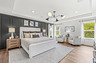 primary bedroom with tray ceiling 