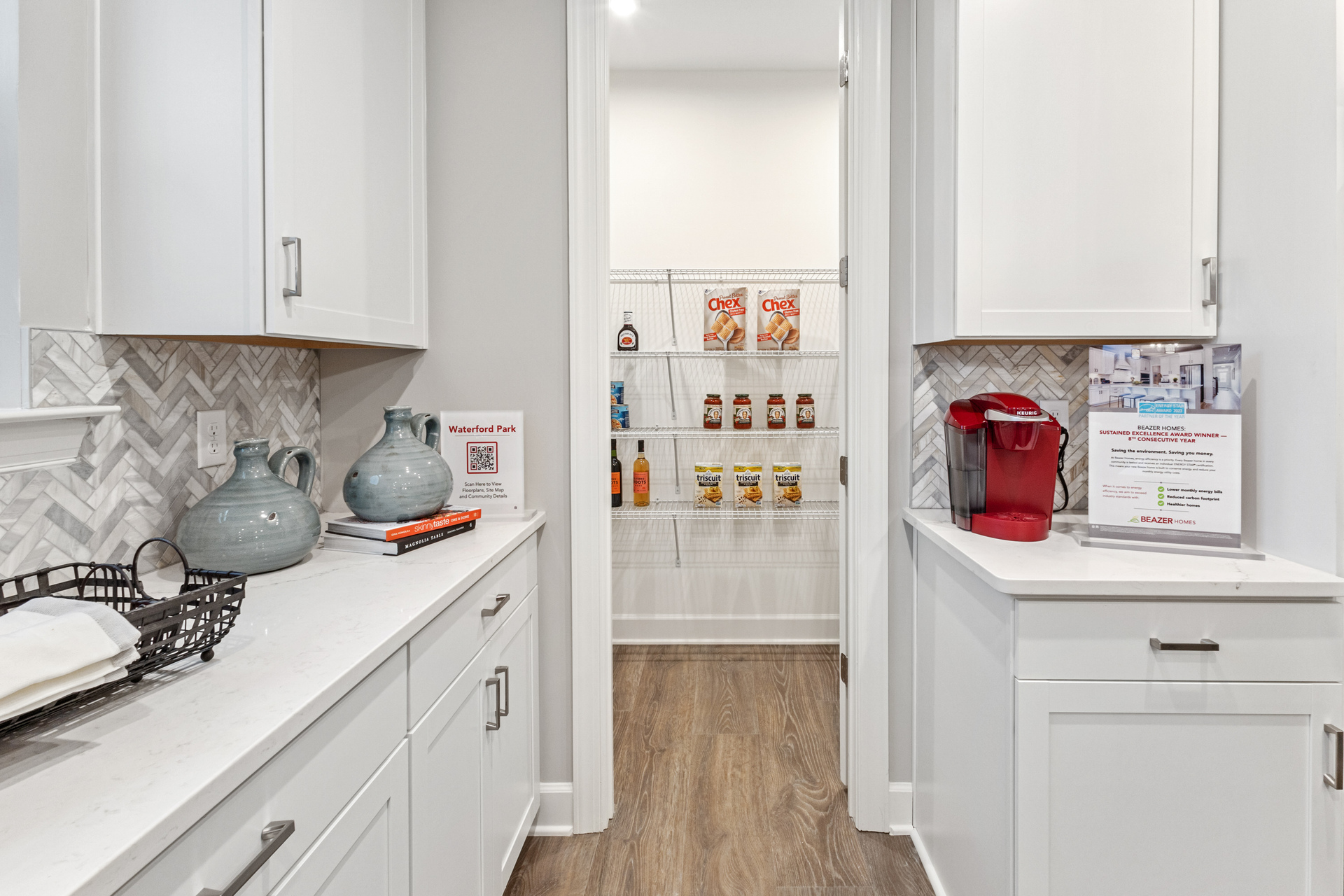 Kitchen with white counters and stainless steel appliances