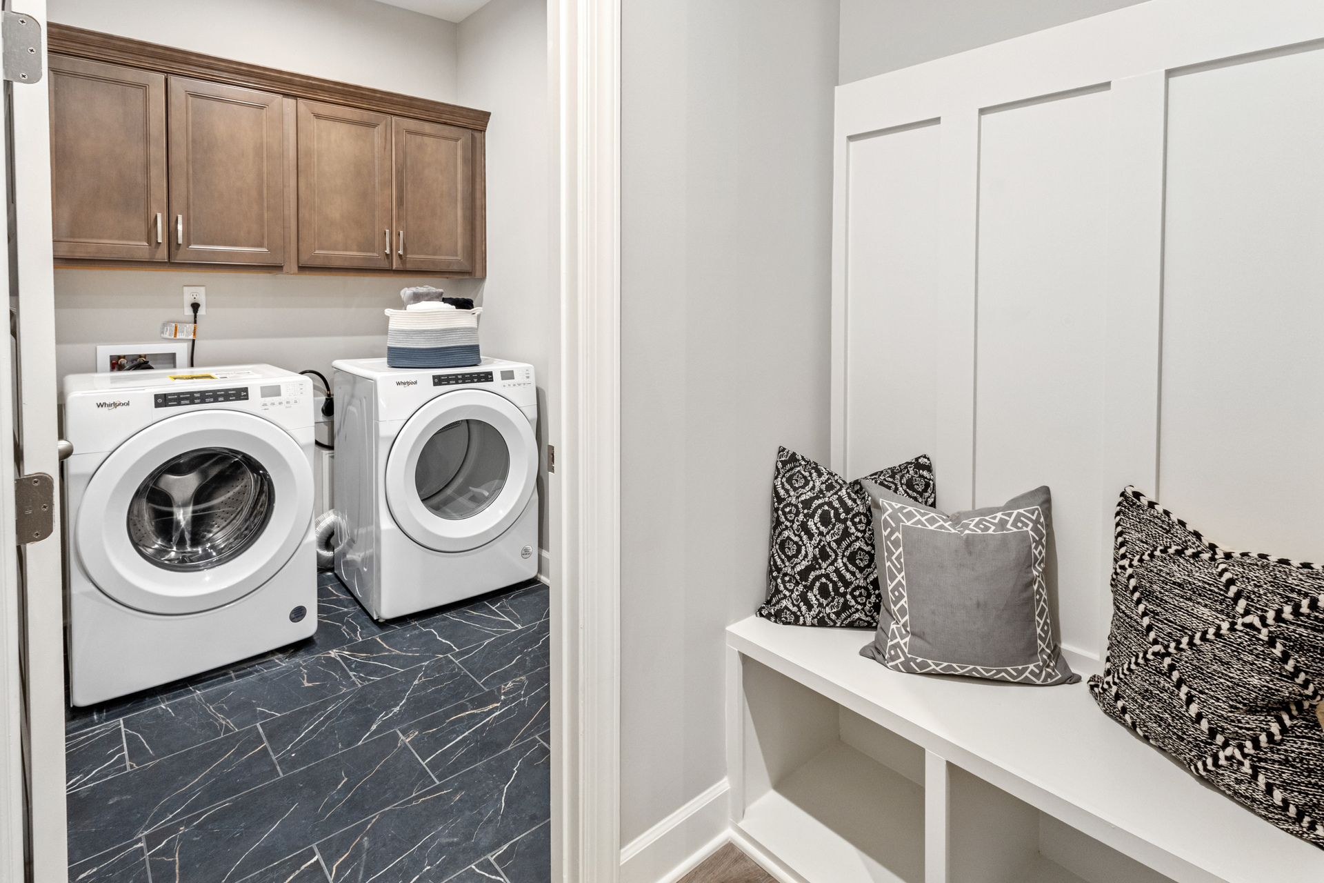 laundry room with overhead storage