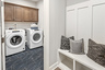 laundry room with overhead storage