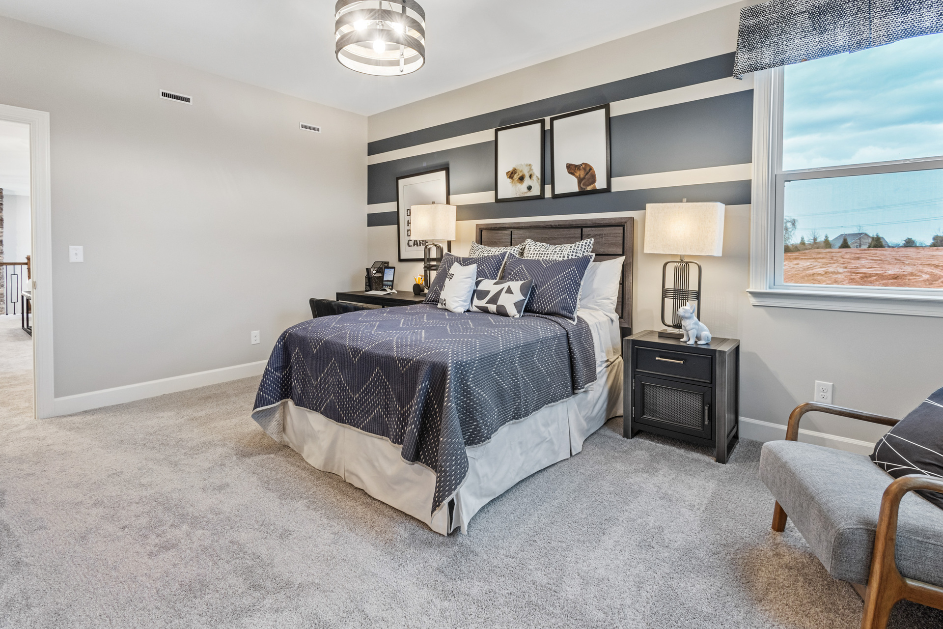 bedroom with carpet and large windows