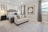 bedroom with carpet and large windows