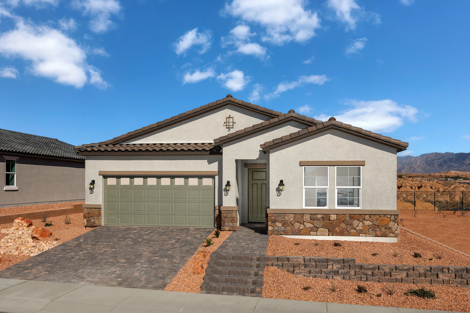 single-story home with desert landscaping