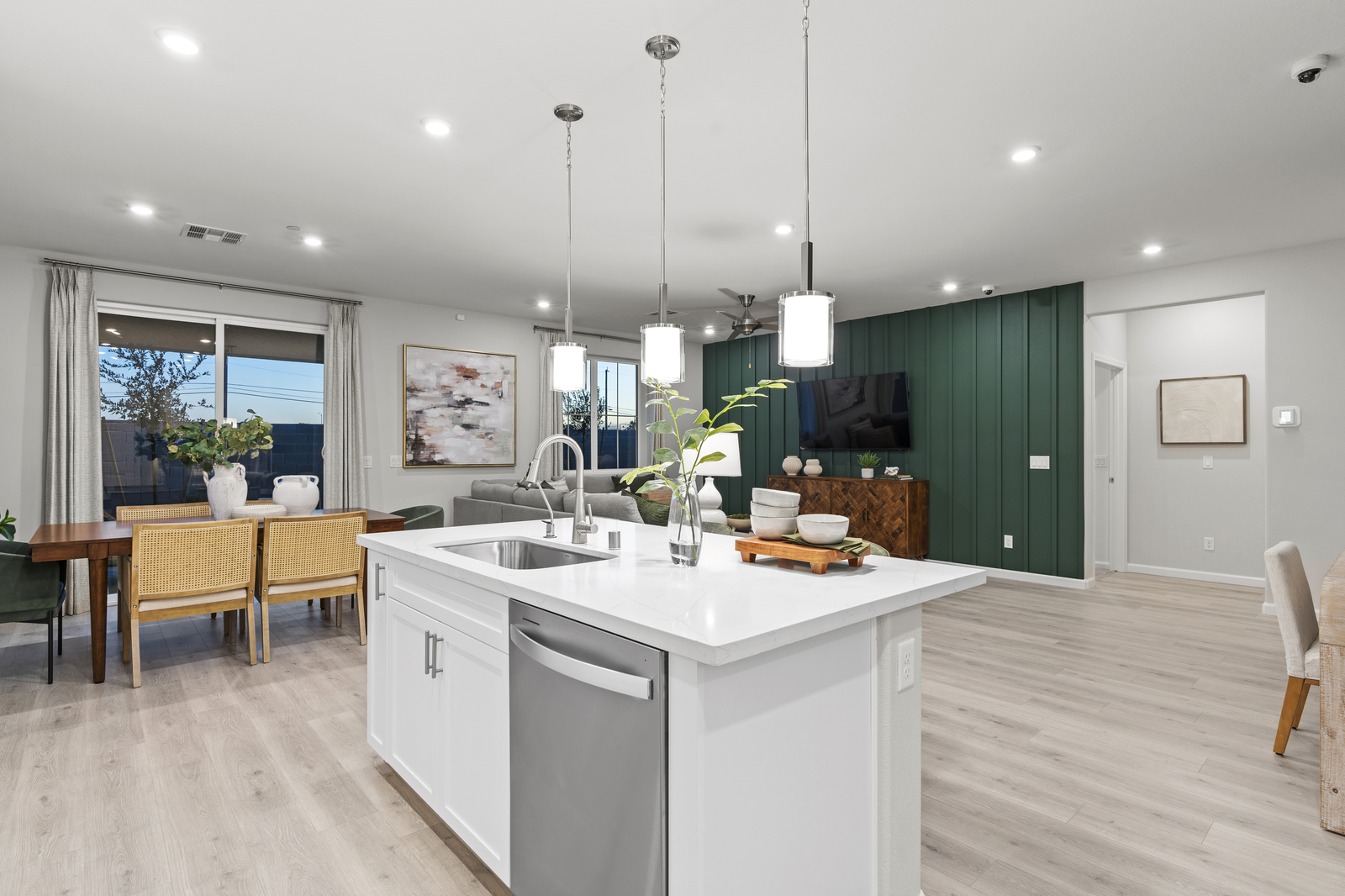 great room with white countertops and accent wall