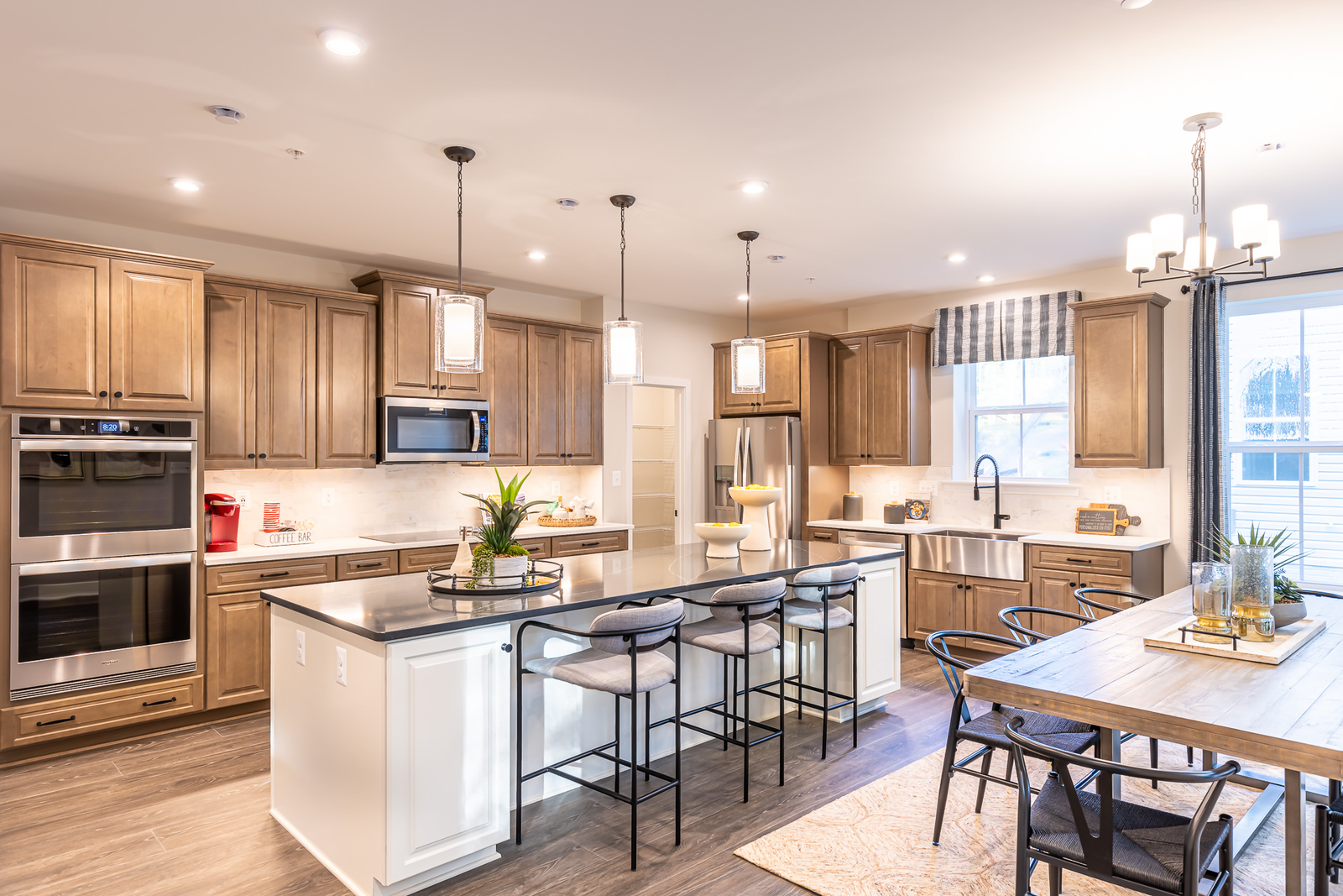 dining area and kitchen with natural wood cabinets