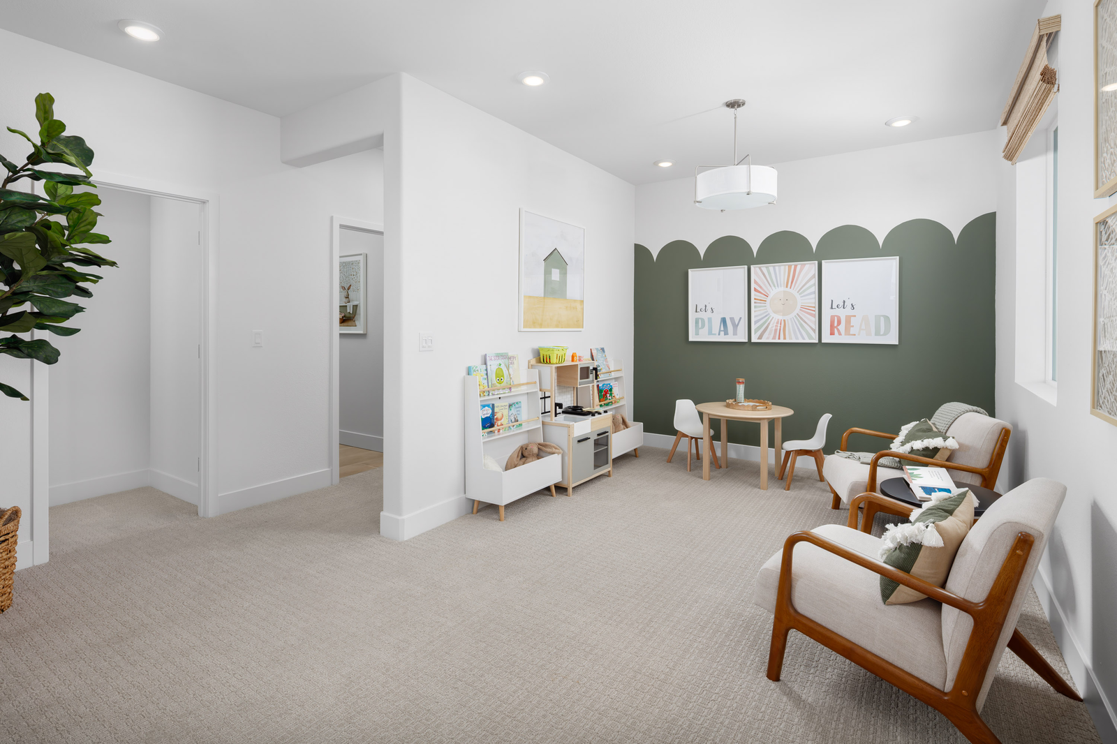 loft with green wall and kids table & chairs